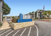 Thumbnail 32 of 33 - the sign for blu at the entrance of a parking lot
