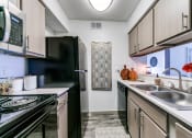 Thumbnail 1 of 30 - the preserve at ballantyne commons apartment kitchen and stove and sink