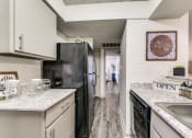 Thumbnail 3 of 29 - our apartments have a modern kitchen with granite counter tops and stainless steel appliances
