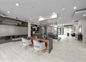 Thumbnail 14 of 33 - a large lobby with a reception desk and chairs