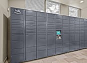 Thumbnail 22 of 33 - A row of Amazon hub vending machines are lined up against a wall.