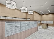 Thumbnail 21 of 33 - A row of mailboxes on a wall in a room.