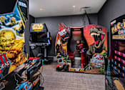 Thumbnail 25 of 25 - A room full of arcade games including Pac-Man.