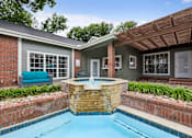 Thumbnail 22 of 42 - A small house with a pool in the backyard.