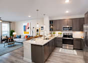 Thumbnail 14 of 33 - side view of the kitchen with over view of the living room