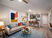 Thumbnail 13 of 33 - living room view with kitchen and barstools