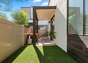 Thumbnail 17 of 30 - a courtyard with grass and a toilet in a house
