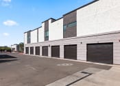 Thumbnail 30 of 30 - the side of a building with rows of garage doors