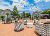 Thumbnail 34 of 39 - our apartments have an outdoor patio with chairs and a pool