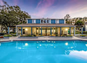 Thumbnail 35 of 35 - A blue house with a pool in front.