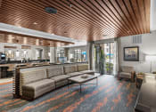 Thumbnail 7 of 25 - a lobby with couches and a coffee table