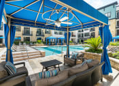 Thumbnail 16 of 25 - the preserve at ballantyne commons pool and patio area with blue umbrellas