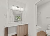 Thumbnail 5 of 24 - a bathroom with a toilet and a sink