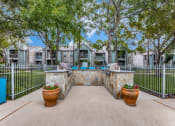 Thumbnail 16 of 24 - the backyard has a pool and trees and a white fence