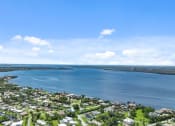 Thumbnail 5 of 41 - an aerial view of a city with a body of water