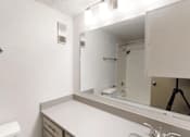 Thumbnail 9 of 66 - a bathroom with a sink and a mirror