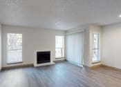 Thumbnail 3 of 66 - an empty living room with white walls and a fireplace