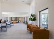 Thumbnail 14 of 66 - the lobby of a hotel with couches and tables and chairs