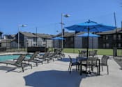 Thumbnail 12 of 66 - our apartments have a large pool and patio with tables and chairs