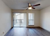 Thumbnail 4 of 66 - an empty living room with a ceiling fan and a window