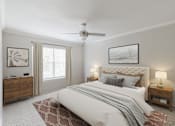 Thumbnail 5 of 31 - A bedroom with a large bed, a ceiling fan, and a dresser.