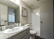 Thumbnail 46 of 66 - the preserve at ballantyne commons apartment bathroom with sink toilet and shower