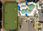 Thumbnail 34 of 66 - an aerial view of a park with a pool and grass