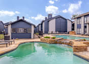 Thumbnail 47 of 66 - a large swimming pool with houses in the background