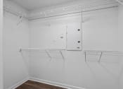 Thumbnail 12 of 25 - a room with white walls and white shelves