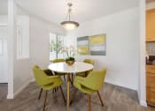Thumbnail 40 of 41 - a dining room with a table and four chairs