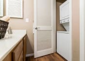 Thumbnail 9 of 21 - a bathroom with a sink and a mirror