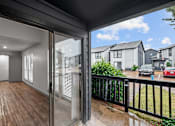 Thumbnail 66 of 66 - the view from the balcony of a home with a large sliding glass door