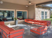 Thumbnail 17 of 32 - Room with red sofas at The Palmera on 3009, Texas, 78154