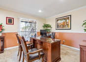 Thumbnail 16 of 18 - a desk with chairs in a room with a window