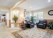Thumbnail 17 of 18 - a living room filled with furniture and a large rug