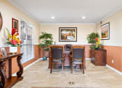 Thumbnail 15 of 18 - a dining room with a table and chairs
