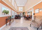 Thumbnail 16 of 32 - a resident clubhouse with a dining table and chairs