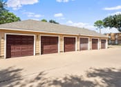Thumbnail 34 of 54 - a row of garage doors in front of a house