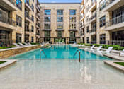 Thumbnail 16 of 38 - A large indoor pool in a residential building.