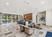 Thumbnail 2 of 38 - A spacious lobby with a reception desk and comfortable seating.