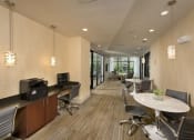 Thumbnail 14 of 23 - a large office space with desks and chairs and a television