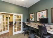 Thumbnail 7 of 15 - a home office with two computers and a counter top
