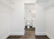 Thumbnail 36 of 42 - a white bathroom with a toilet and a closet