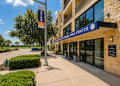 Thumbnail 2 of 35 - A building with a sign that says "Hilland Town Center".