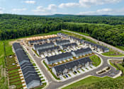 Thumbnail 1 of 37 - A bird's eye view of a residential area with houses and roads.