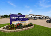 Thumbnail 23 of 23 - A sign for The Sebastian Lillian Crossroad with a phone number on it.