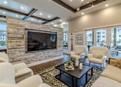 Thumbnail 9 of 41 - A living room with a fireplace and a couch.