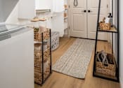 Thumbnail 9 of 21 - A white oven and fridge in a small kitchen.