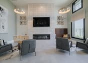 Thumbnail 40 of 43 - a living room with a fireplace and a tv