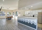 Thumbnail 19 of 28 - a large kitchen with a pool table and a billiards table